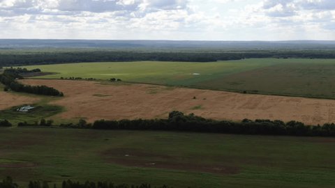 Aerial Drone Moving over Rural Field