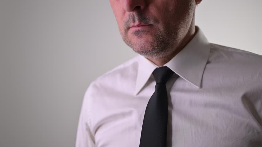 Businessman blowing whistle with raised finger warning gesture, concept of whistleblower, 4K with selective focus