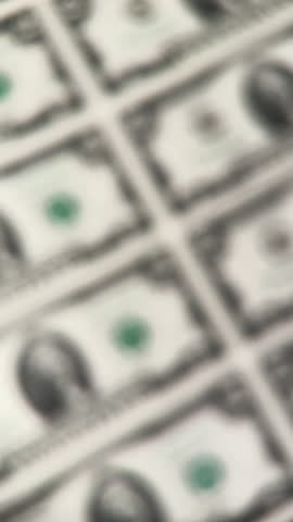 Serial numbers on uncut sheet of two dollar bills. Close up.