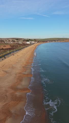 Aerial video of  Winter sunlight over Weymouth promenade and seafront, Dorset, England