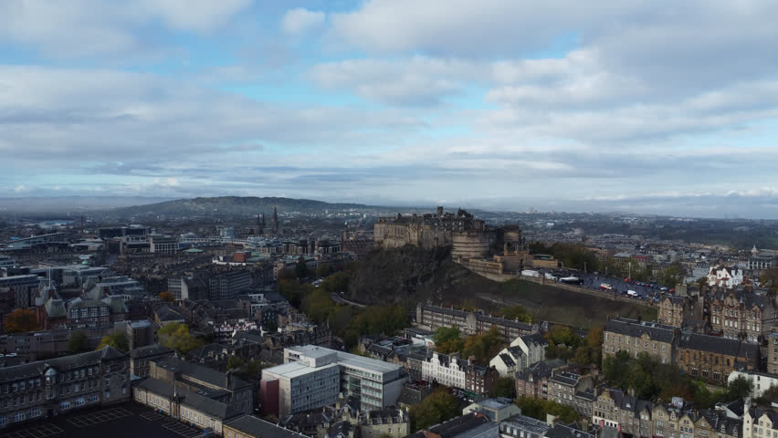 Panning shot of Edinburgh Castle and Scott Monument 