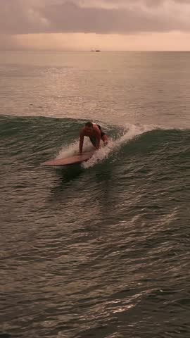Golden Horizon Caucasian Longboarder Smooth Glide, Along Glassy Ocean Surface With Mellow Sunset Tones, Gentle