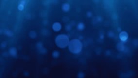 Soft blue bokeh light particles on a deep blue background - Powered by Shutterstock - Get 15% off with code: PIKWIZARD15
