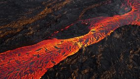 Hot Molten Lava Flowing Across Volcanic Terrain - Powered by Shutterstock - Get 15% off with code: PIKWIZARD15