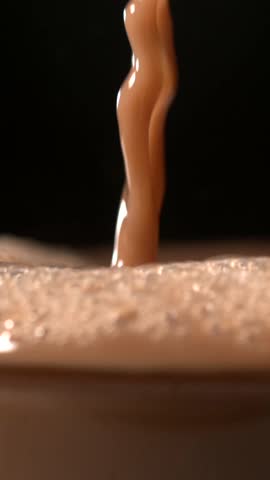 Super slow motion Dynamic airborne chocolate droplets, Closeup of chocolate splashes with highspeed micro