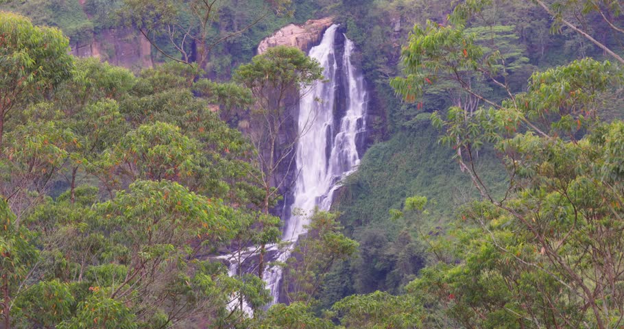 Devon Falls Cascading Over Dark Rock Formations in Dense Tropical Forest, Sri Lanka