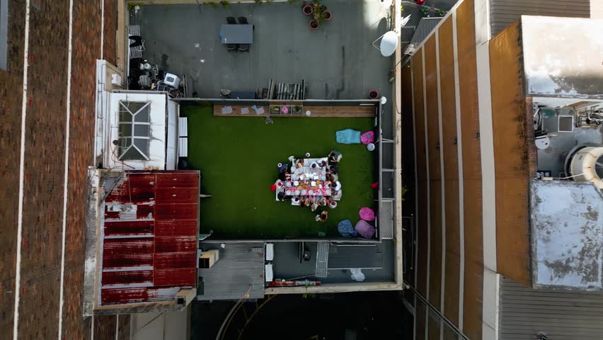 Cinematic 4K drone footage soaring above tall buildings in the Sydney CBD, revealing rooftops, city geometry, and pedestrians moving below, capturing the scale, energy, and modern urban life of Australia’s largest city.