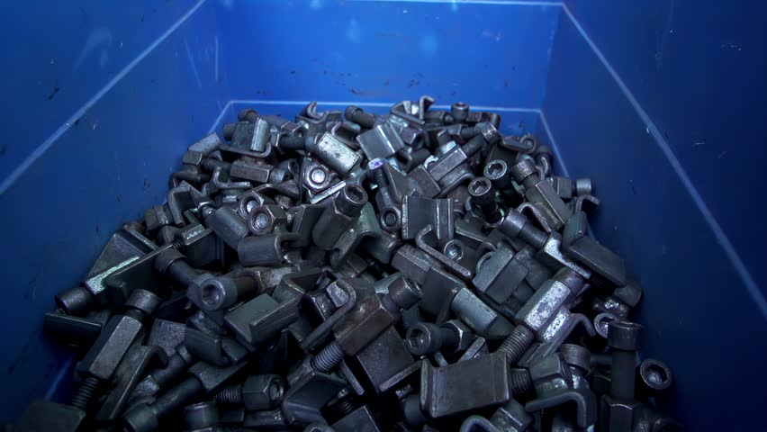 Pile of assorted metal spare parts fasteners recycling bolts, nuts, brackets