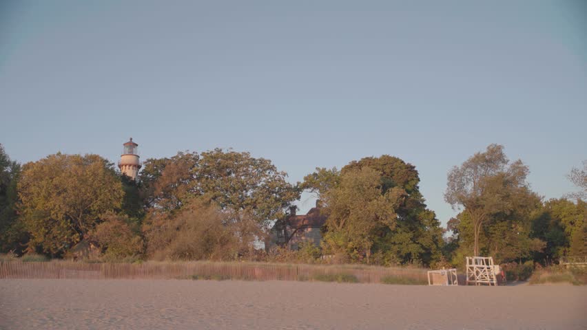 Wide Shot of Grosse Point Lighthouse and Evanston Beach at Golden Hour, Illinois