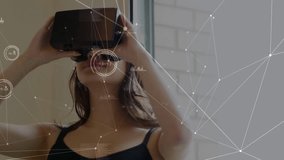 Network of connections and data processing over woman wearing vr headset at office. Global networking and business technology concept - Powered by Shutterstock - Get 15% off with code: PIKWIZARD15