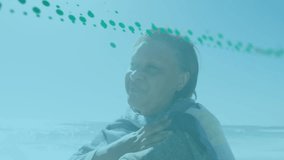 Animation of data processing over senior woman at beach. Global data processing, lifestyle and digital interface concept digitally generated video. - Powered by Shutterstock - Get 15% off with code: PIKWIZARD15