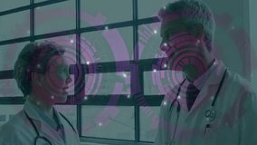 Discussing with digital interface overlay, doctors collaborating in hospital setting. Healthcare, technology, innovation, collaboration, teamwork, medical - Powered by Shutterstock - Get 15% off with code: PIKWIZARD15