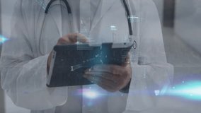 Data processing over portrait of caucasian senior male doctor using digital tablet at hospital. Medical healthcare and technology concept - Powered by Shutterstock - Get 15% off with code: PIKWIZARD15