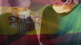 Animation of spanish flag over caucasian male and female surgeons performing surgery at hospital. National medical healthcare technology concept - Powered by Shutterstock - Get 15% off with code: PIKWIZARD15