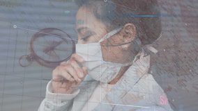 Animation of data processing over women wearing face mask. Global covid 19 pandemic, science and connections concept digitally generated video. - Powered by Shutterstock - Get 15% off with code: PIKWIZARD15
