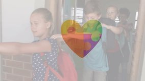 Animation of puzzle and heart over diverse schoolchildren walking. Autism awareness month, celebration and digital interface concept digitally generated video. - Powered by Shutterstock - Get 15% off with code: PIKWIZARD15
