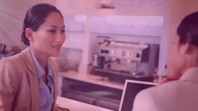 Animation of network of digital icons against two diverse businesswomen discussing at office. Global networking and business technology concept - Powered by Shutterstock - Get 15% off with code: PIKWIZARD15