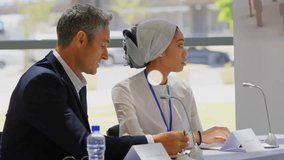 Animation of network of connections with icons over diverse colleagues having meeting in office. Global business, connections, communication and digital interface concept digitally generated video. - Powered by Shutterstock - Get 15% off with code: PIKWIZARD15