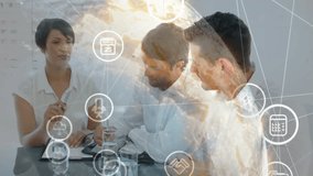 Collaborating at table, business team in office with animation of digital icons. Teamwork, collaboration, corporate, technology, innovation, brainstorming - Powered by Shutterstock - Get 15% off with code: PIKWIZARD15