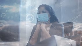 Animation of data processing and clouds over businesswoman with face mask. global business and digital interface during covid 19 pandemic concept digitally generated video. - Powered by Shutterstock - Get 15% off with code: PIKWIZARD15