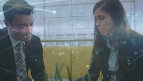 Animation of network of connections over business people in office. Global business technology networking connections and digital interface concept digitally generated video. - Powered by Shutterstock - Get 15% off with code: PIKWIZARD15