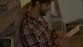 Animation of financial data processing over caucasian man using tablet. Global finance, business, connections, computing and data processing concept digitally generated video. - Powered by Shutterstock - Get 15% off with code: PIKWIZARD15