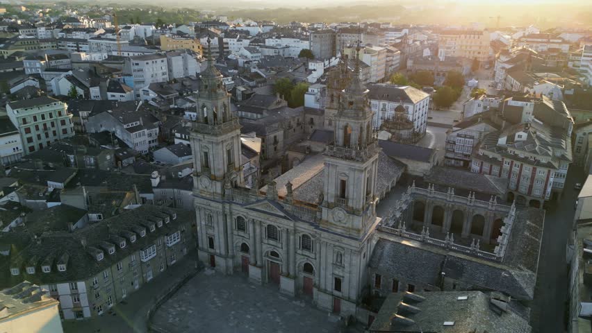Historic city of Lugo in Galicia, Spain, Cathedral of Santa Maria de Lugo and ancient Roman Walls surrounding preserved medieval old town, European cultural heritage landmark. Aerial View
