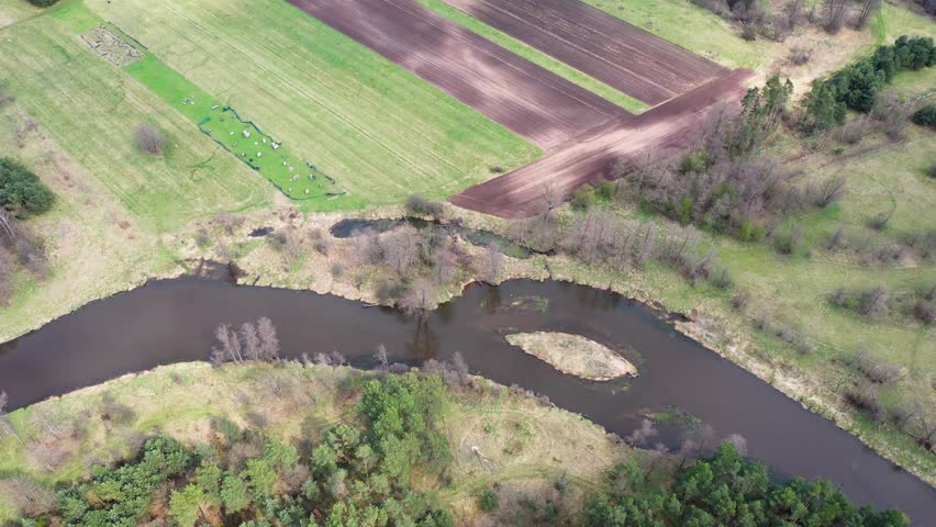 Fields and Liwiec River near Starowola village in Masovian Voivodeship of Poland, 4k video