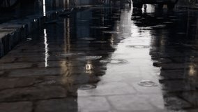 Detailed 4k shot of rain in puddle on a wet urban street surface, showing ripples and reflections. Perfect for weather, cityscape, and nature themes. - Powered by Shutterstock - Get 15% off with code: PIKWIZARD15