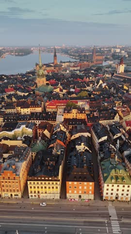 Gamla Stan Old Town in Stockholm, Sweden, historic medieval center with colorful buildings, narrow streets and waterfront surrounded by islands and waterways. Aerial View shows iconic city core