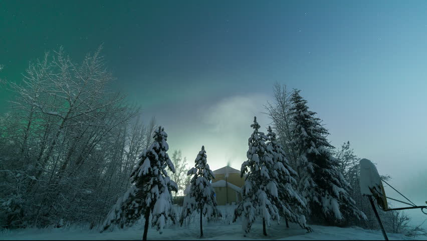 Timelapse of Aurora Borealis Northern Lights over winter landscape in Fairbanks, Alaska