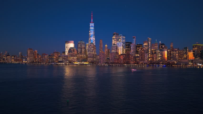 New York City cityscape, NYC aerial view. New York Manhattan with Freedom Tower and WTC. New York with World Trade Center WTC an Freedom Tower at night. New York City panorama at night.