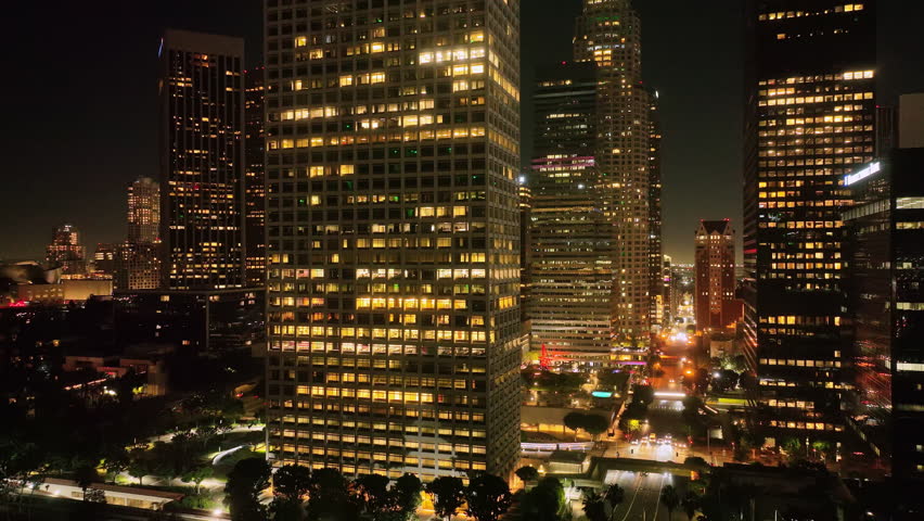 Downtown Los Angeles lights. Los Angeles city skyline at night. LA skyline aerial video. Night aerial view LA. Los Angeles skyscrapers at night. LA downtown timelapse. Los Angeles at night panorama.
