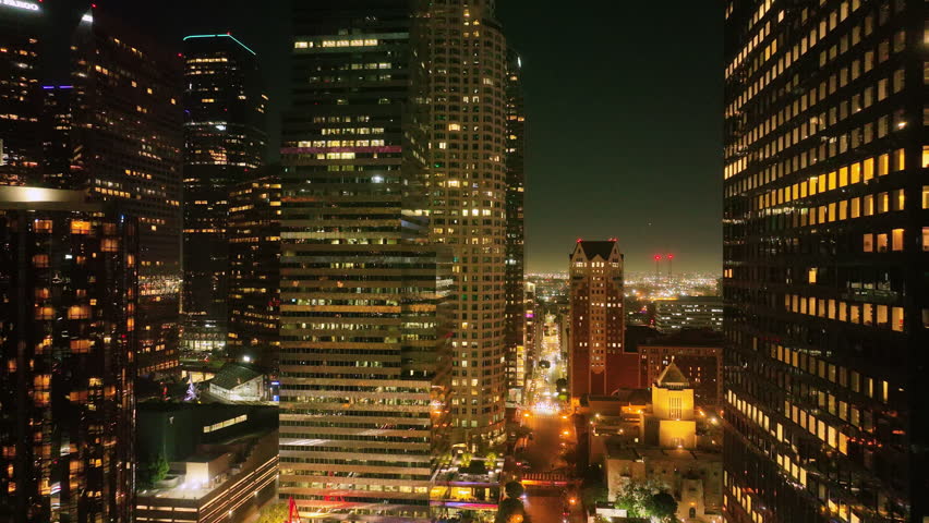 Los Angeles night aerial motion. LA skyline with city lights. Los Angeles skyscrapers at night. LA downtown timelapse. Los Angeles city lights. Los Angeles night drone shot.