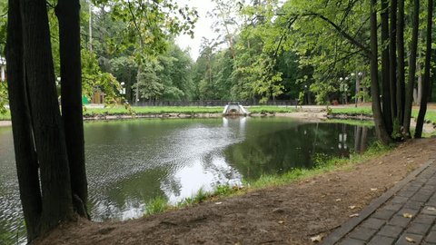 Drone Flying Forward over Pond Krasnogorsk Park
