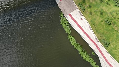 Vertical Drone Flight over River Promenade