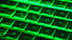 Fast camera movement over a green backlit keyboard creates abstract green light trails, ending with a sharp focus on the Enter key. Modern technology background representing speed, data flow, digital workflow, computing and cyber concepts. - Powered by Shutterstock - Get 15% off with code: PIKWIZARD15