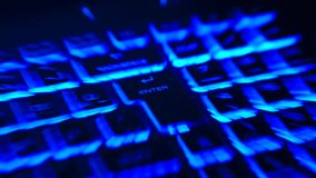 Abstract blue data light streaks created by fast zoom motion over a backlit keyboard, focusing on the Enter key. Futuristic technology and digital data background. - Powered by Shutterstock - Get 15% off with code: PIKWIZARD15