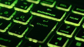 Green backlit keyboard with dynamic light streaks created by fast zoom motion and long exposure, focusing on the Enter key. Futuristic technology background. - Powered by Shutterstock - Get 15% off with code: PIKWIZARD15