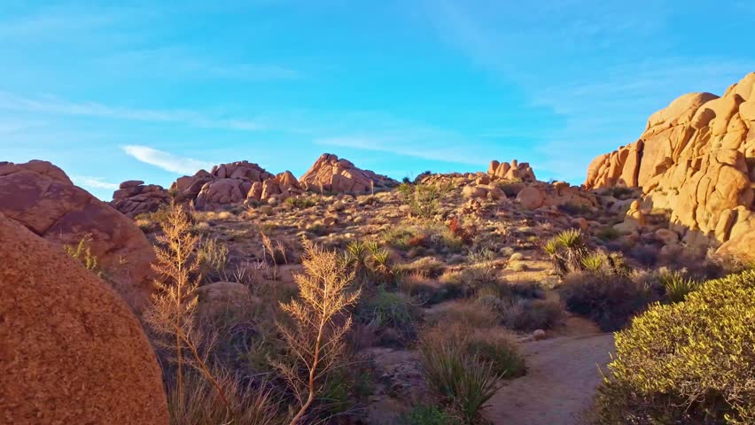Vibrant sunset view of rock formations along Mastodon Peak Trail in Joshua Tree National Park California