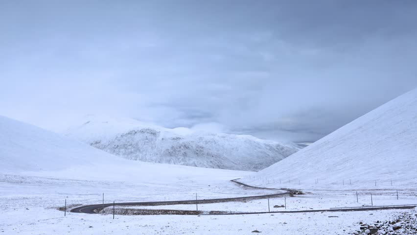Breathtaking 4K UHD drone and time-lapse footage of stunning winter snowscapes and snow-capped mountains, showcasing a magical winter wonderland with snow-covered peaks, frozen lakes, and frost-kissed forests. Capturing soft powdery snow, golden hour light on snow-capped ridges, and ethereal snow mist, the video highlights the pristine beauty of nature in winter. Perfect for Shutterstock users—ideal for winter travel promotions, ski resort campaigns, nature documentaries, and commercial design projects seeking authentic.