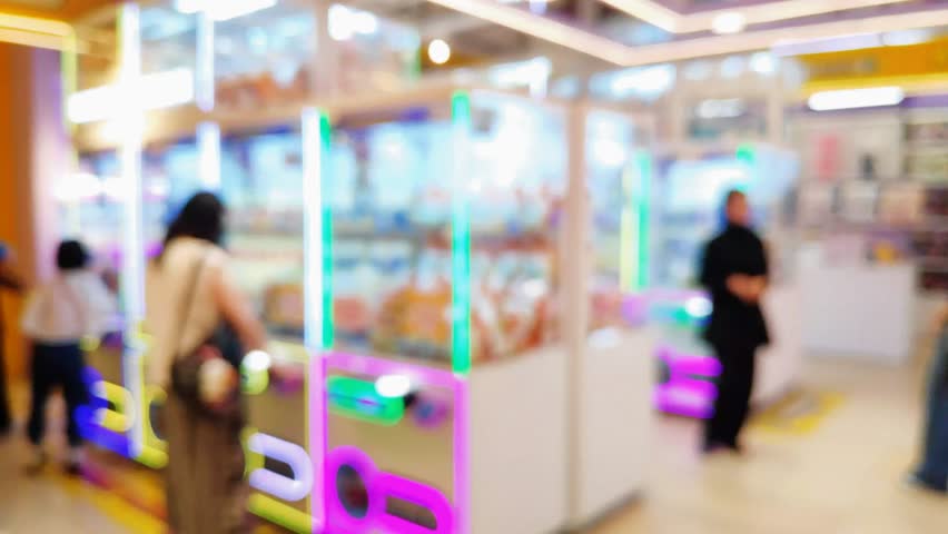 Abstract blurred interior of an arcade with elegant design and warm lighting, creating a comfortable environment for entertainment and leisure.