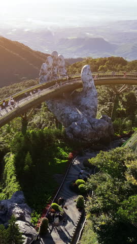 Tourist walking at Golden bridge in Bana hills, Da nang, Vietnam.