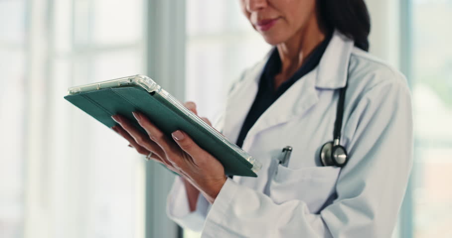 Hands, doctor and tablet with woman in hospital for typing, surgery schedule and healthcare. Digital records, tech and medical advice with person in clinic for treatment research and planning