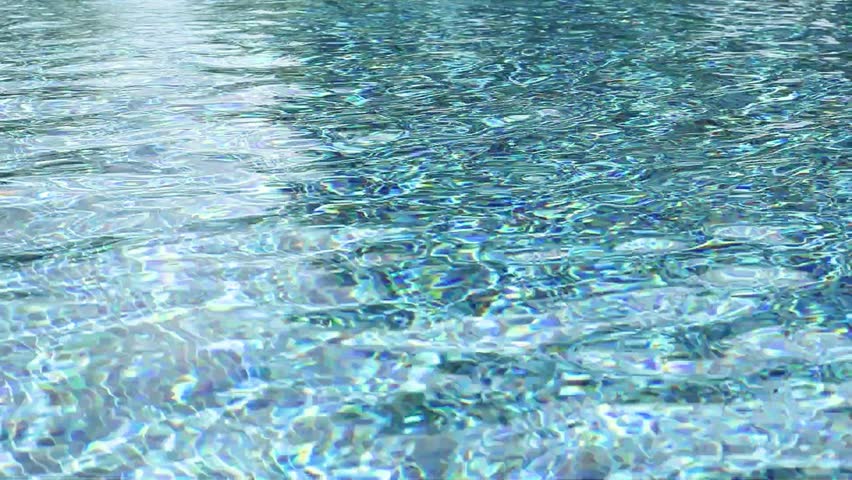 Swimming pool with blue crystal clear water surface and ripple wave background
