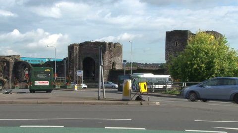 NEWPORT, UK - SEPTEMBER 2011: Road traffic at a junction in Newport with its castle in the background.