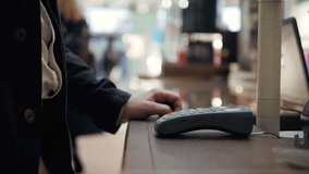 Man paying for purchase using smartphone in shop with futuristic interface animation showing successful transaction - Powered by Shutterstock - Get 15% off with code: PIKWIZARD15