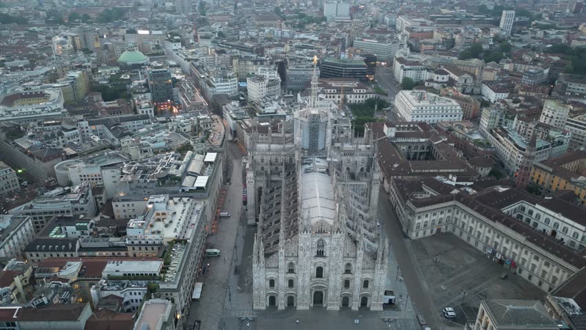 4K Aerial Drone footage of Milan Duomo Cathedral panning sideways in a semi-circle