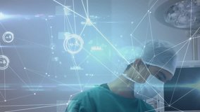 Animation of network of connections over male surgeon talking with patient. global medicine and digital interface concept digitally generated video. - Powered by Shutterstock - Get 15% off with code: PIKWIZARD15