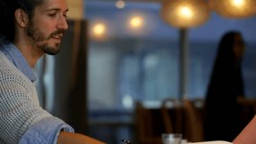 Animation of data processing over diverse business people taking notes. Business technology and teamwork concept. - Powered by Shutterstock - Get 15% off with code: PIKWIZARD15